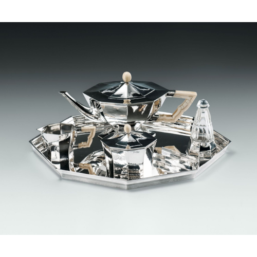SILVER TEA SET
consisting of: teapot, creamer, covered sugar bowl, sugar tongs, rum flacon, tray